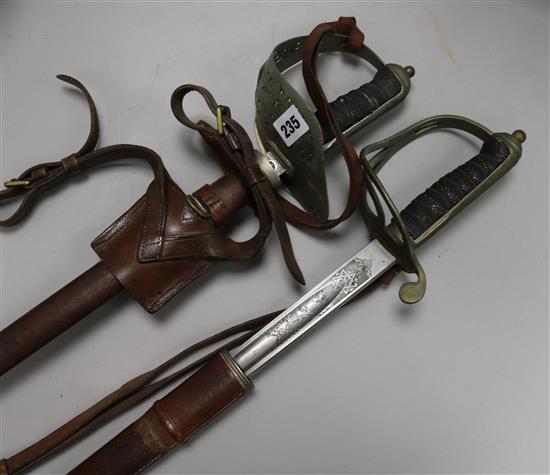 Two George V officers swords, in leather scabbards 102cm